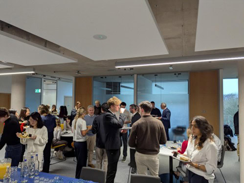 A photograph of people talking and eating on the Bath campus